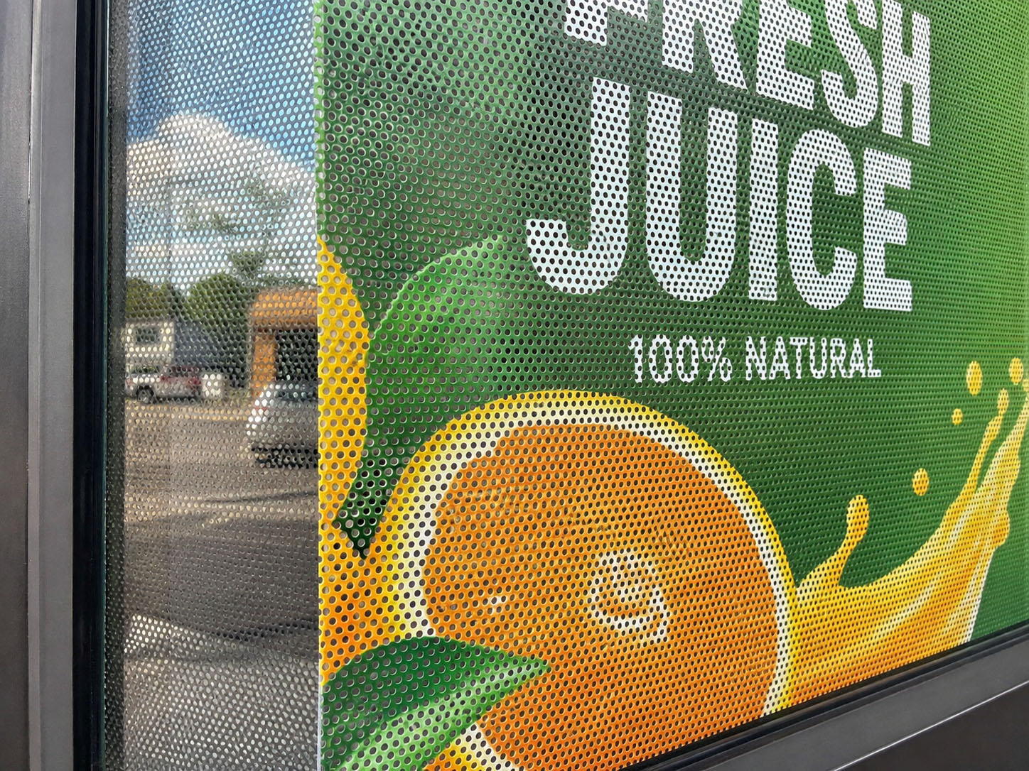 Close-up view of perforated One Way Vision Sticker holes